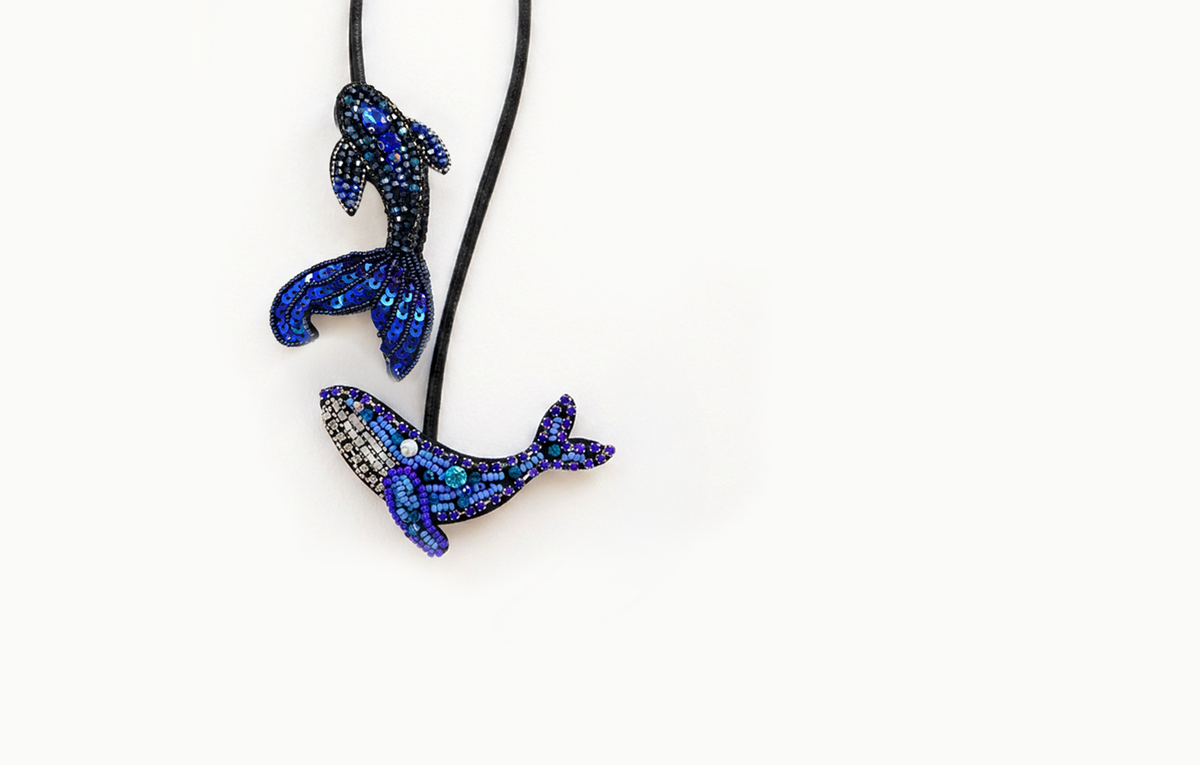 Blue beaded dolphin and whale bag charm