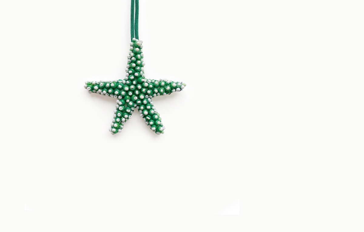 Green beaded starfish bag charm