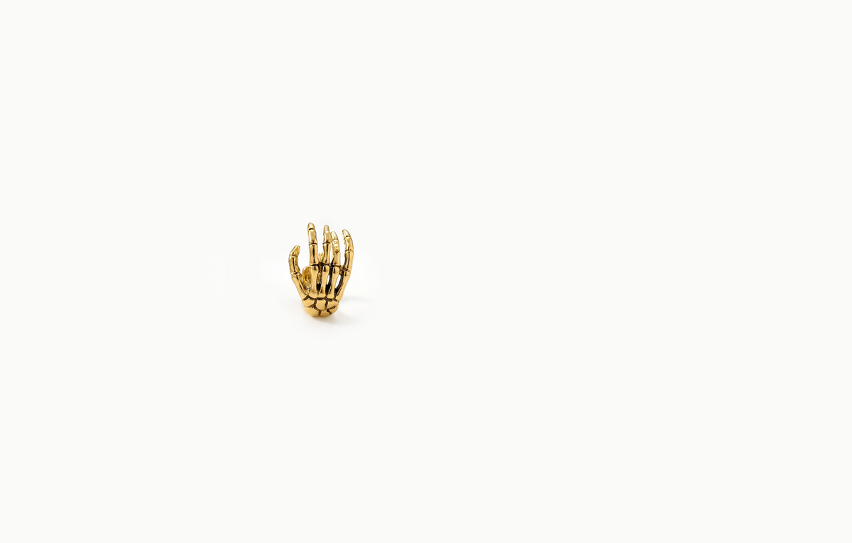 Gold skeleton hand ear cuff
