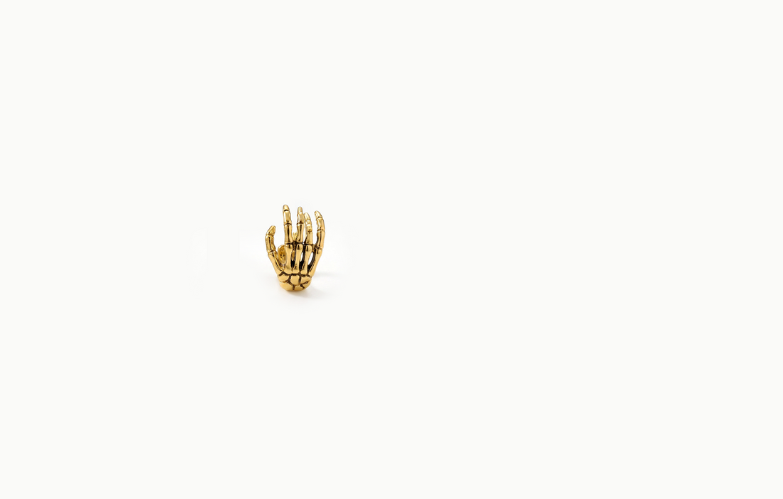 Gold skeleton hand ear cuff