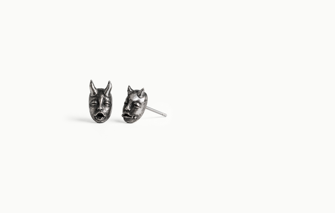 Dark silver horned devil face stud earrings