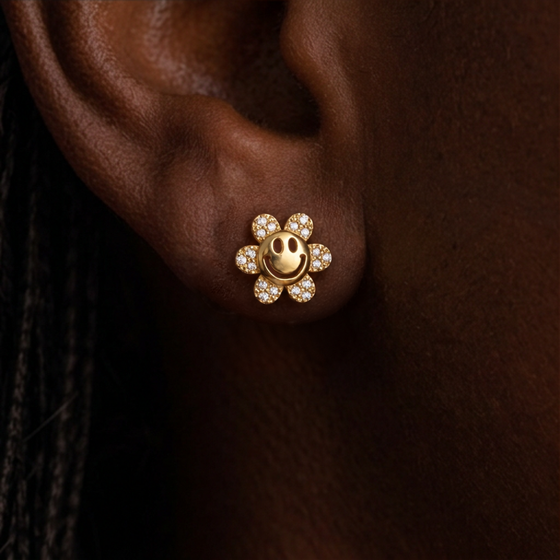 Flower Power stud earrings, gold smiley flower with crystal petals worn on the ear
