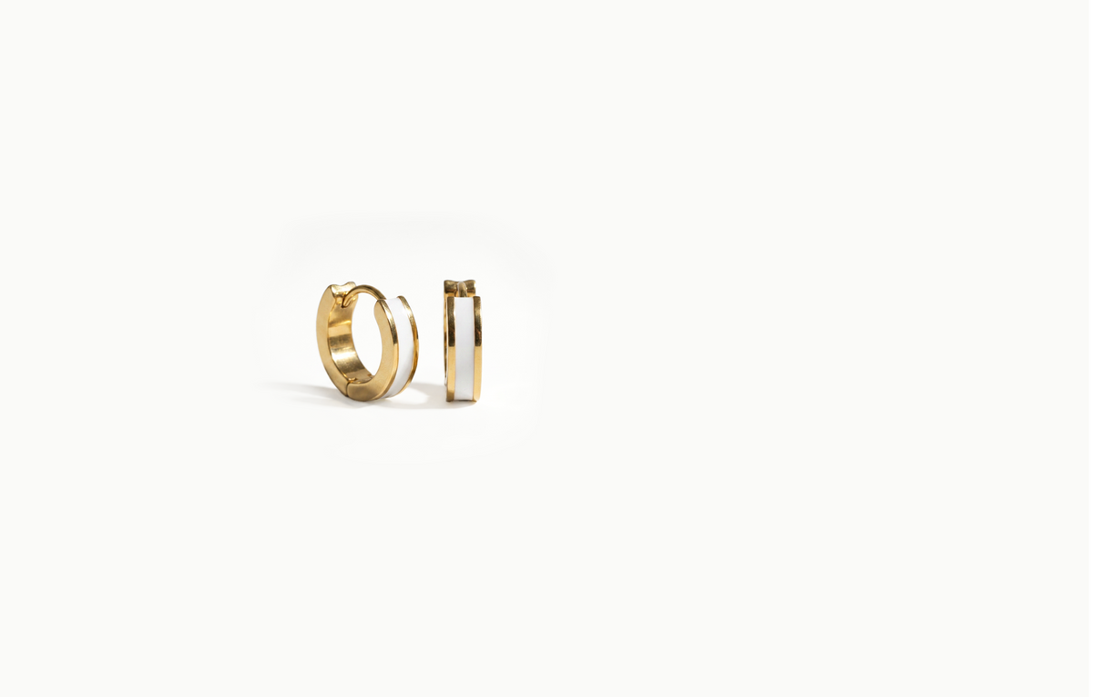 Chunky gold hoop earrings with a white inlay