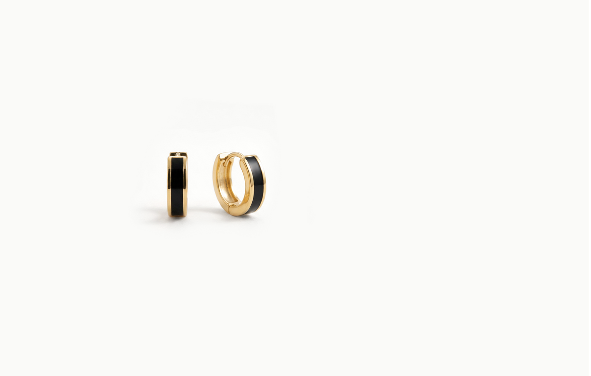 Chunky gold hoop earrings with a black inlay