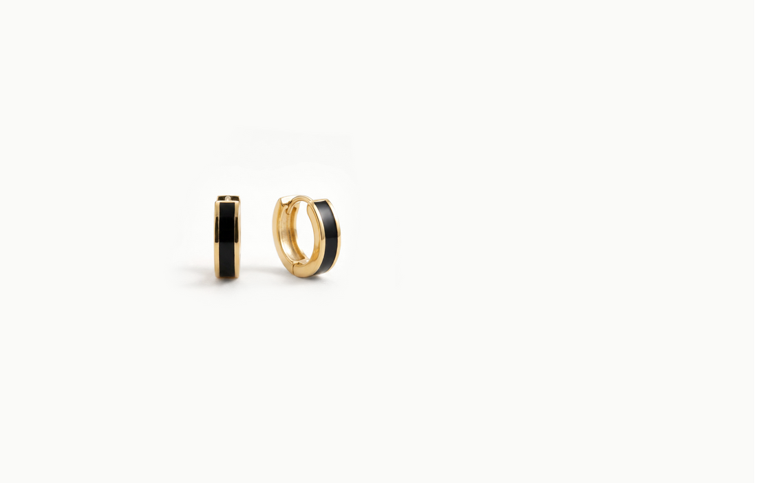 Chunky gold hoop earrings with a black inlay