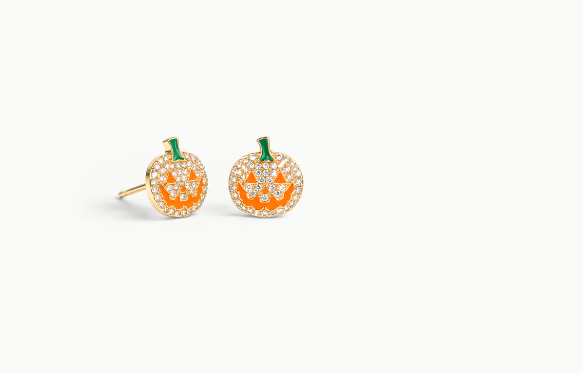 Gold crystal pumpkin earrings with an orange face and green stem