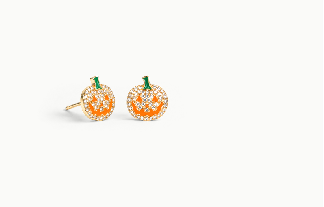 Gold crystal pumpkin earrings with an orange face and green stem