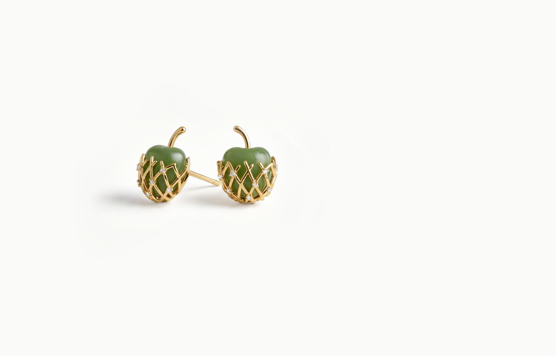 Green apple stud earrings wrapped in a gold lattice with crystals