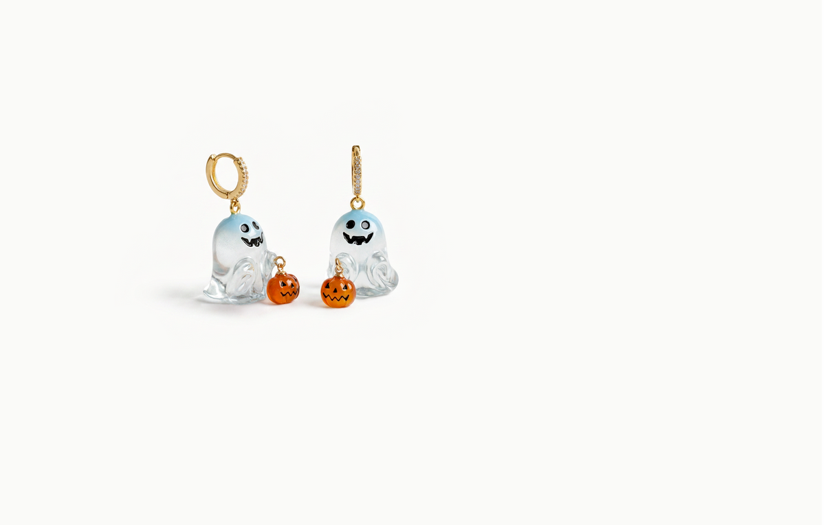Gold crystal drop earrings with a translucent blue ghost holding an orange pumpkin
