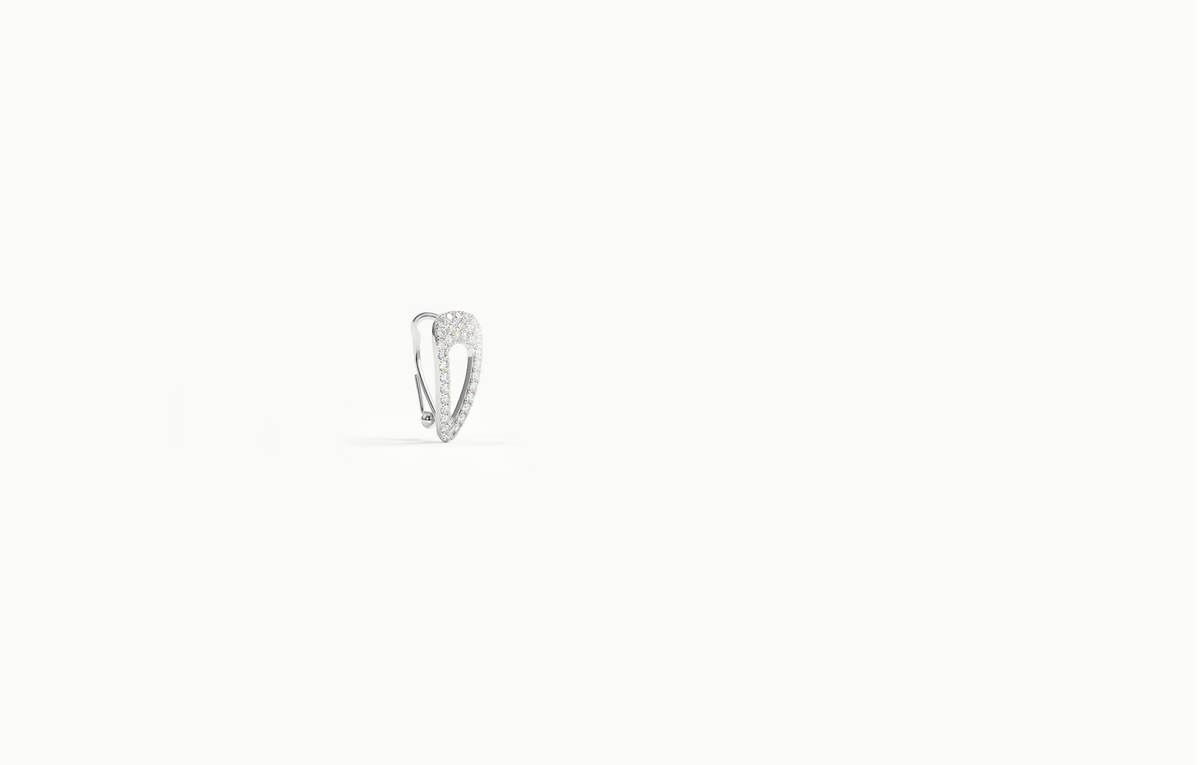Silver ear cuff shaped like a hair clip, covered in crystals