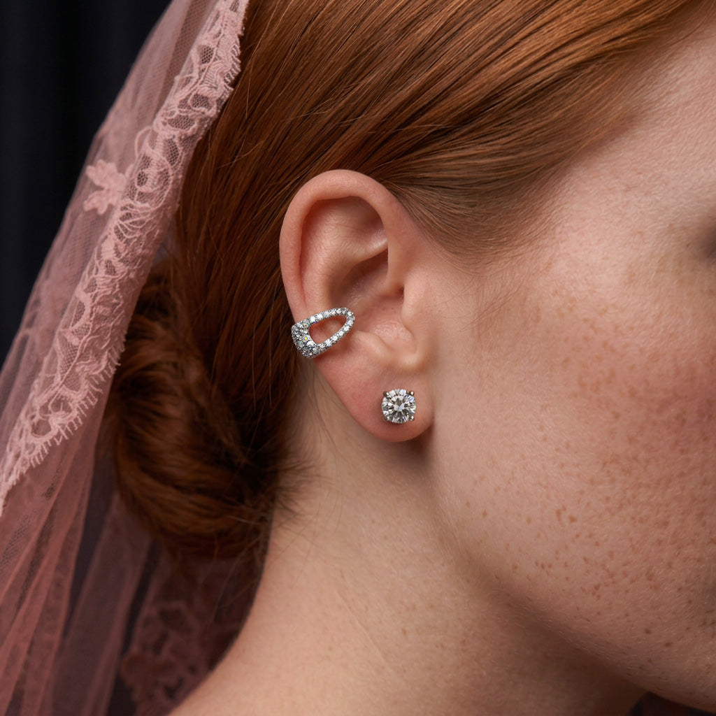 Crystal Hair-Clip ear cuff worn on the upper ear with a crystal stud, against a sheer pink lace veil