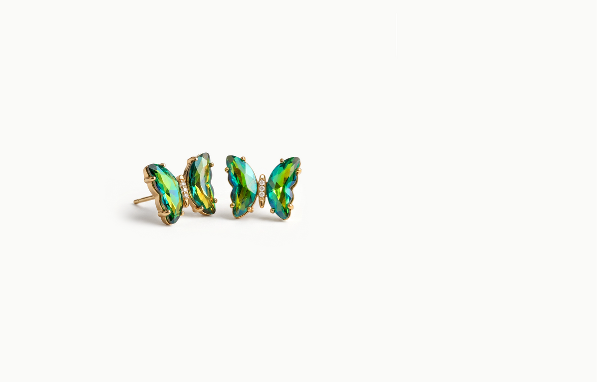 Gold butterfly stud earrings with iridescent green crystal wings