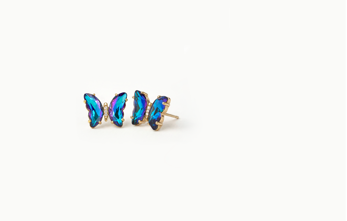 Gold butterfly stud earrings with iridescent blue and purple crystal wings