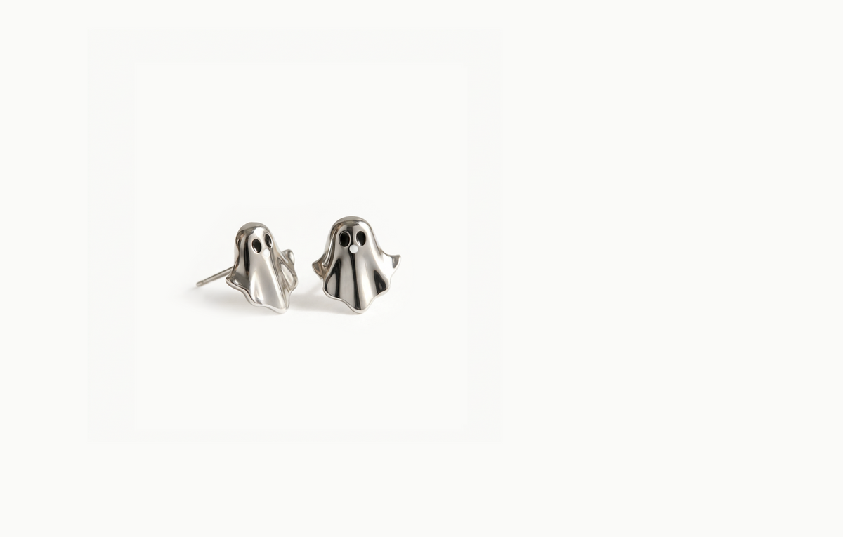 Silver ghost stud earrings with black eyes