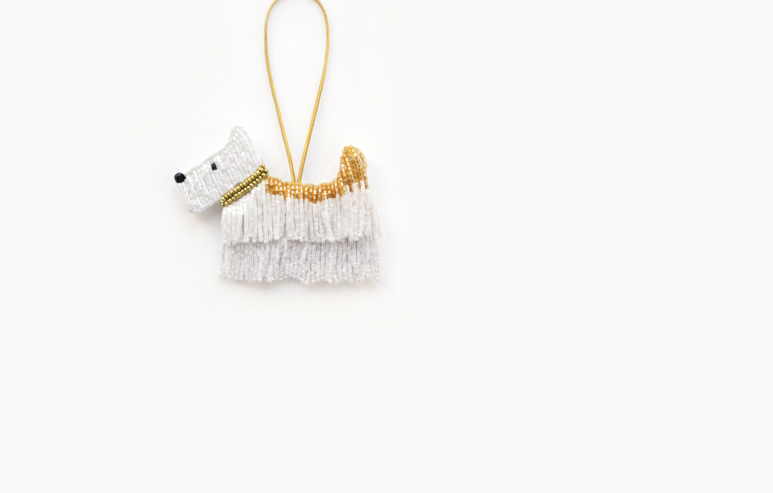 White and gold beaded westie dog bag charm with a fringed bead coat