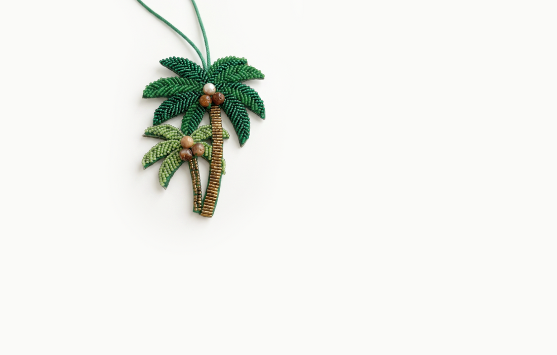Green beaded double palm tree bag charm with gold trunks