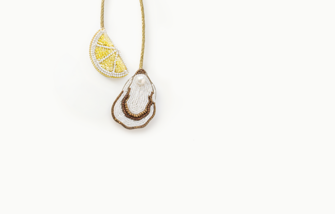 Beaded lemon slice and oyster shell bag charm