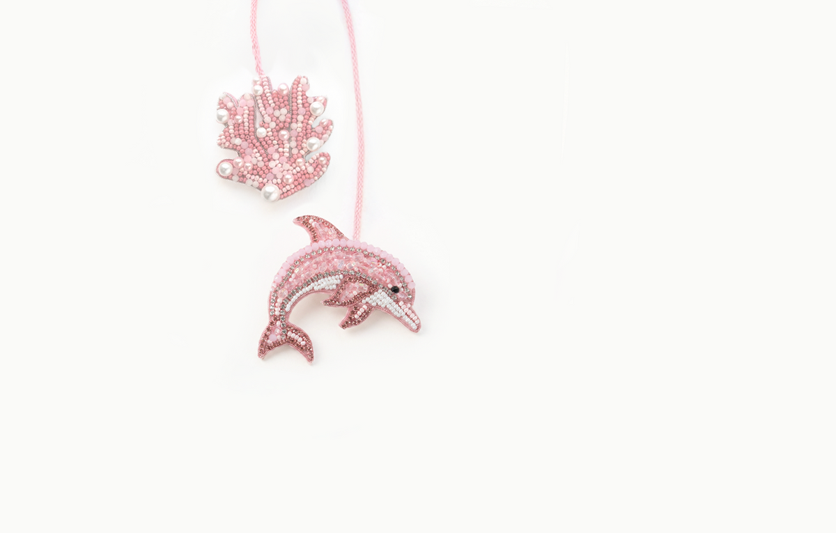 Pink beaded dolphin and coral bag charm