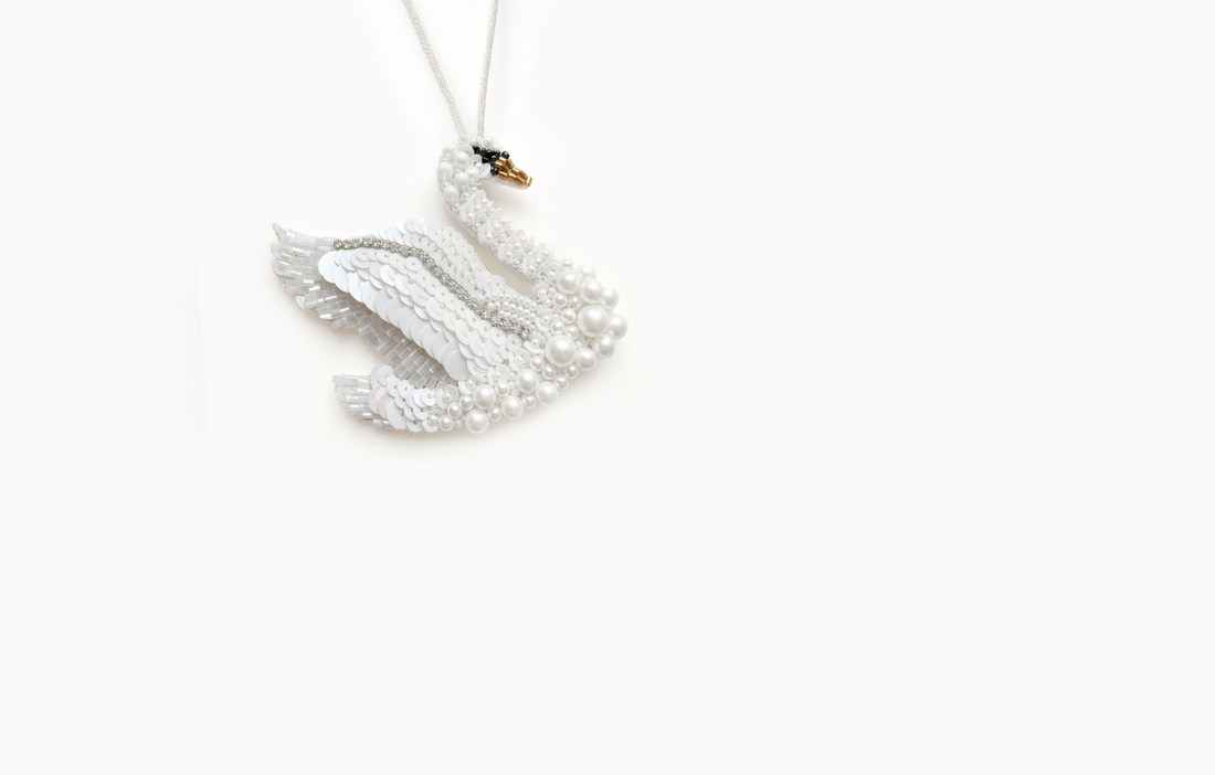 White beaded and sequined swan bag charm