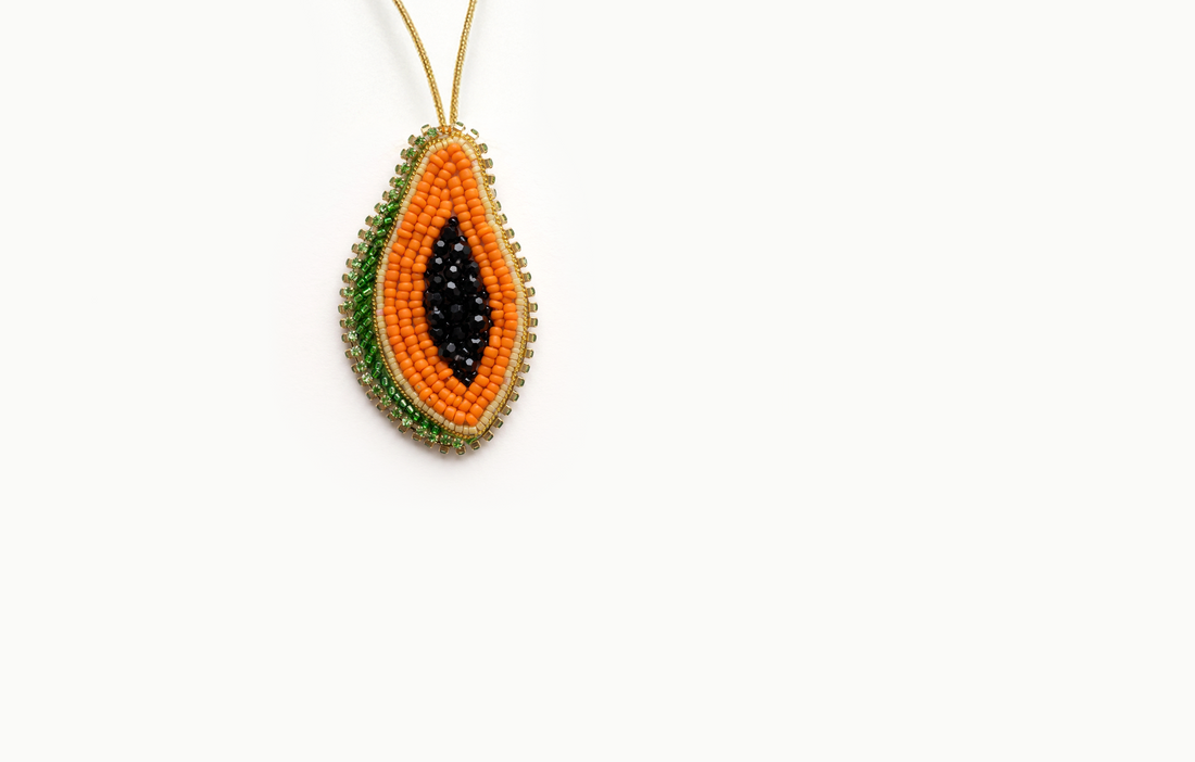 Orange beaded papaya bag charm