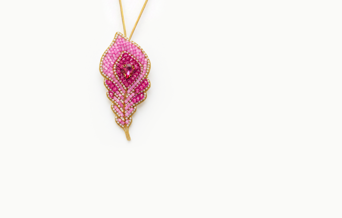 Pink beaded feather bag charm