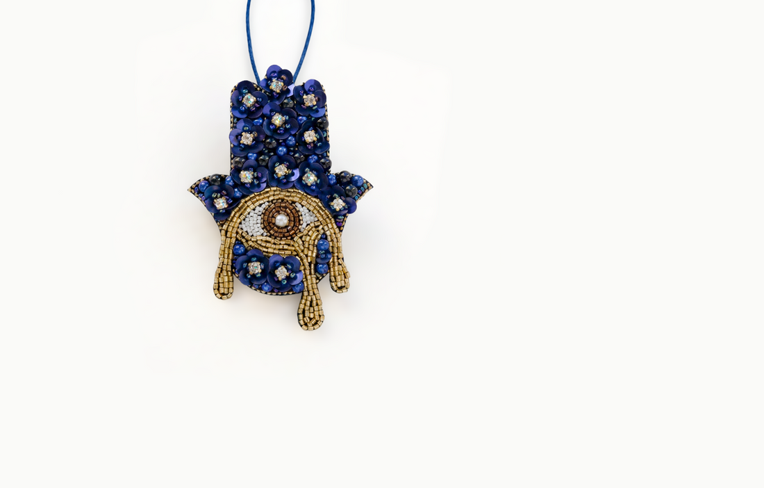 Blue and gold beaded eye bag charm