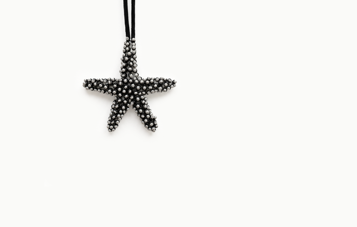 Black and white beaded starfish bag charm