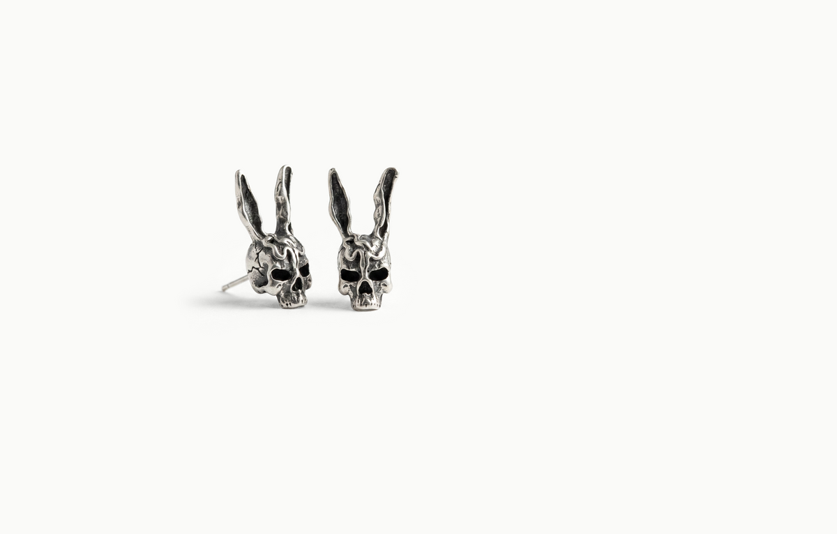 Silver rabbit skull stud earrings with tall ears