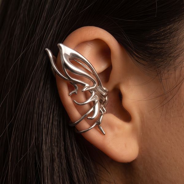 Liquid Butterfly crystal ear cuff worn on the ear, silver butterfly wing outline, dark hair