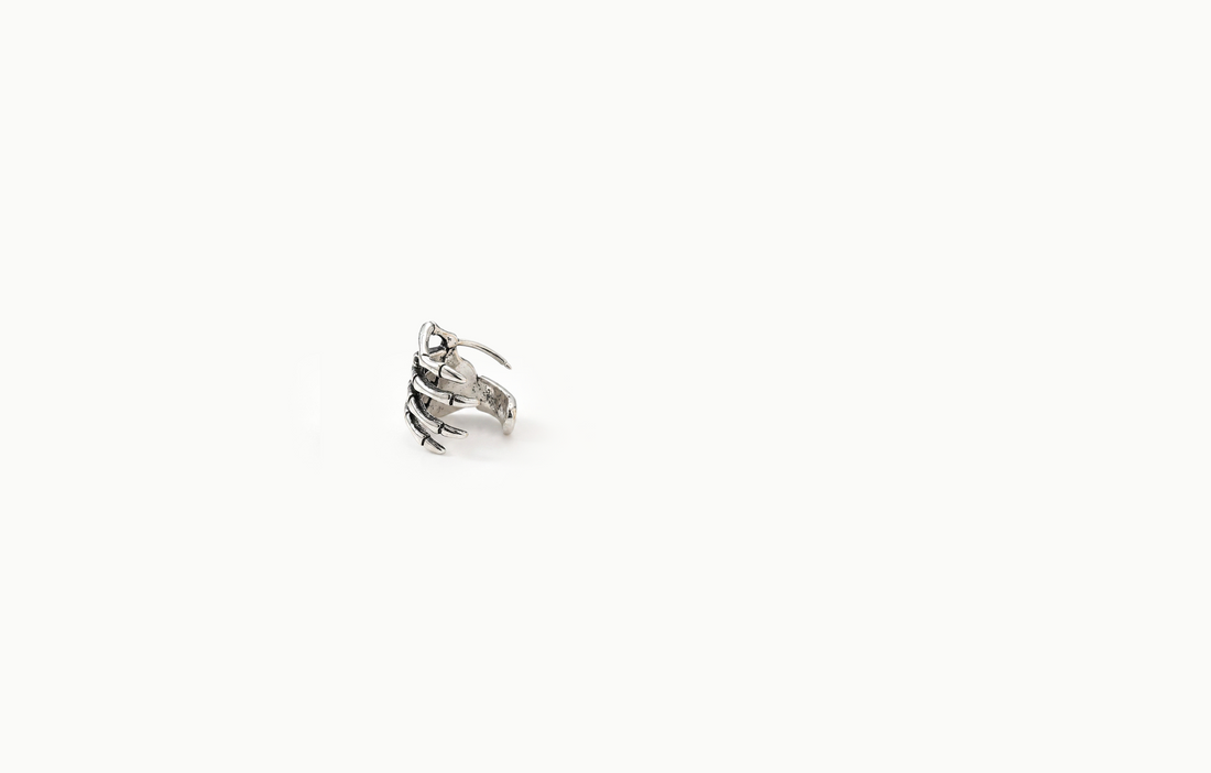 Silver skeleton hand ear cuff