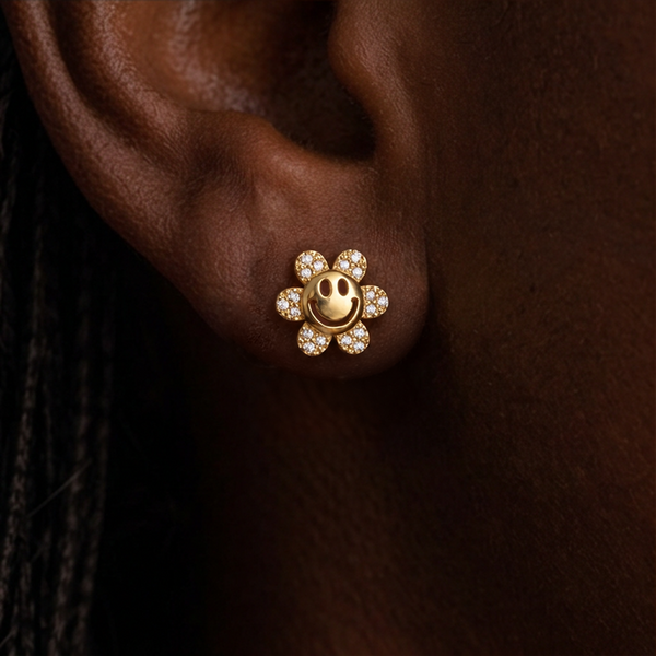 Flower Power stud earrings, gold smiley flower with crystal petals worn on the ear