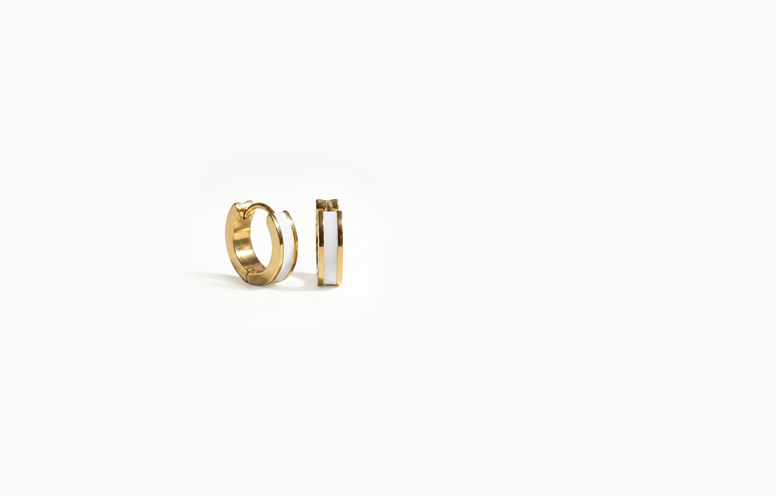 Chunky gold hoop earrings with a white inlay