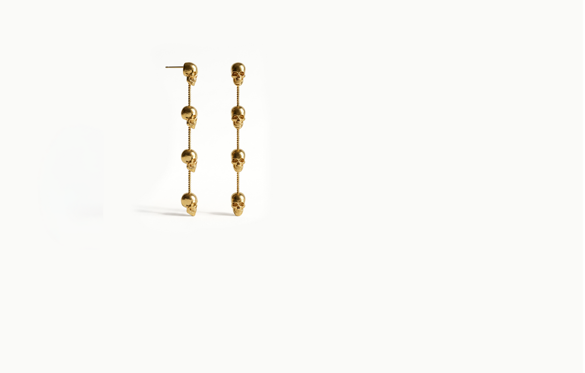 Long gold chain drop earrings with four skulls