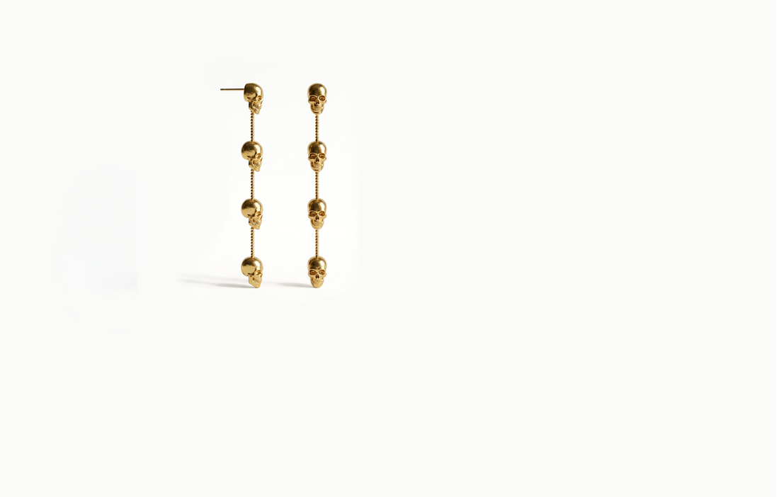 Long gold chain drop earrings with four skulls