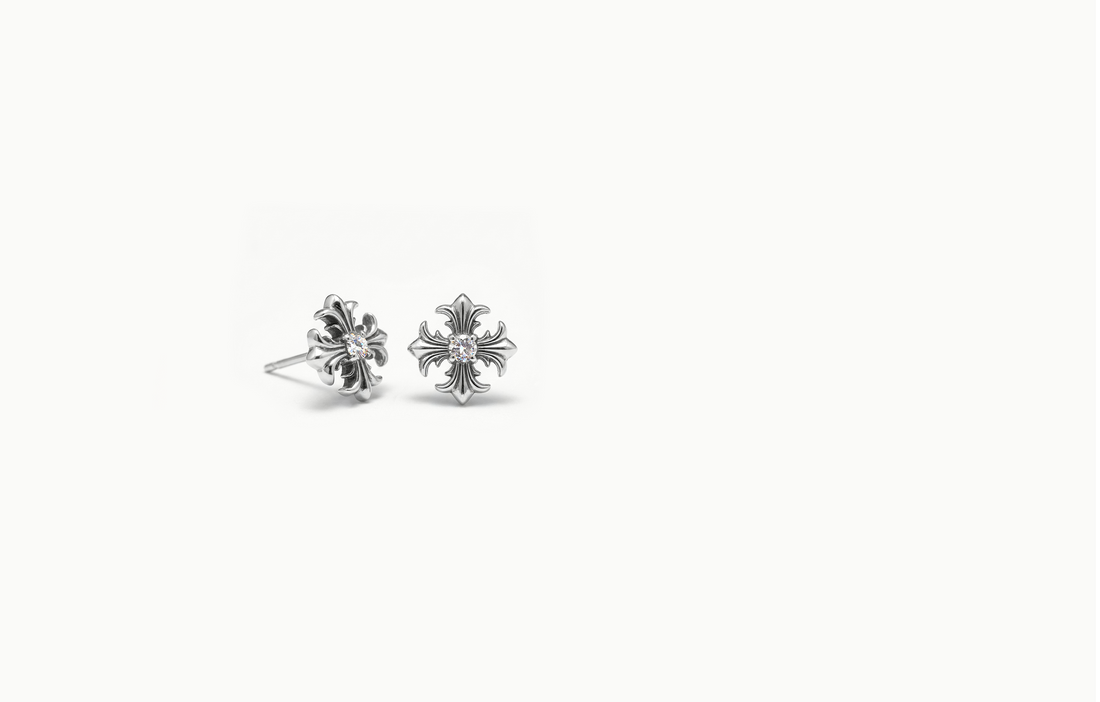 Ornate silver cross stud earrings with a crystal