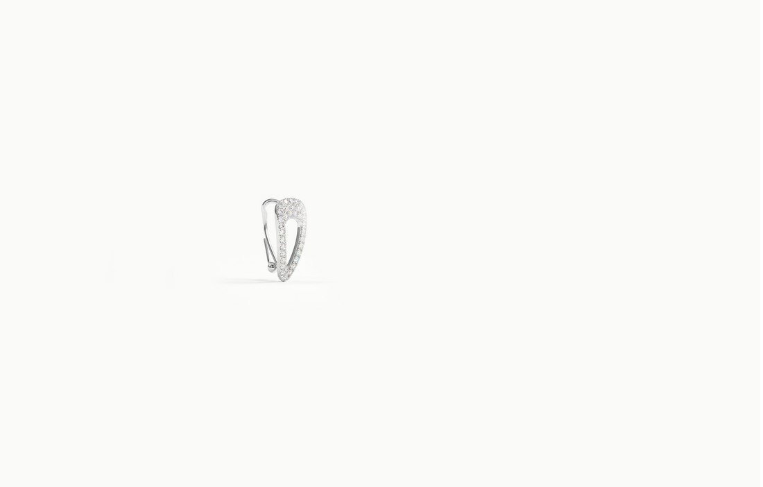Silver ear cuff shaped like a hair clip, covered in crystals