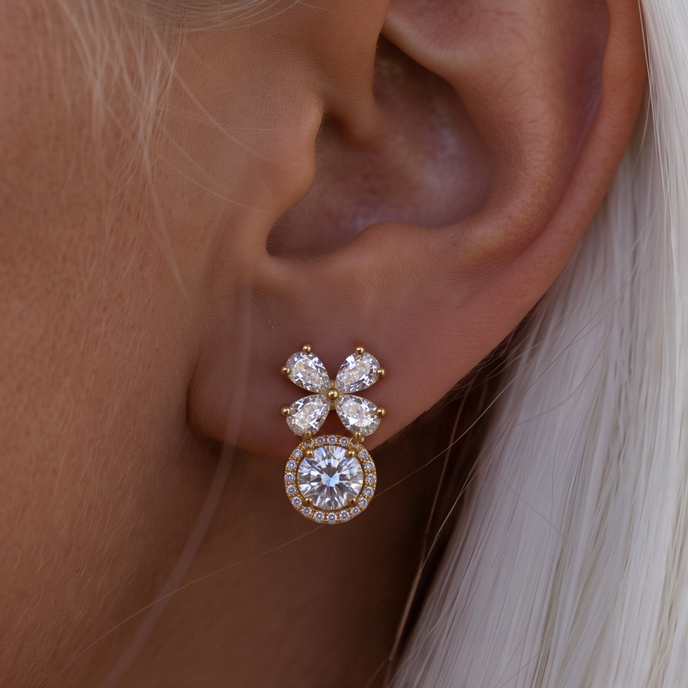 Crystal Blossom Halo earring worn on the ear, close-up of crystal petals over a round halo, white hair behind