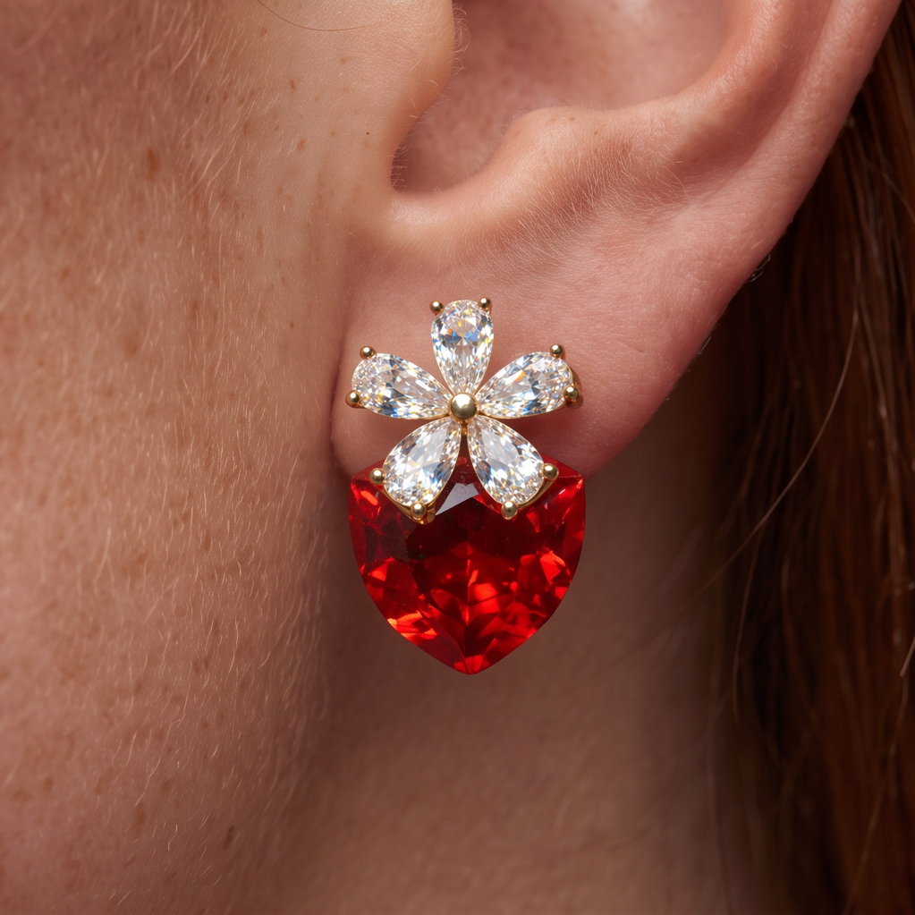 Strawberry Fields crystal earring worn on the ear, crystal flower above a red crystal strawberry