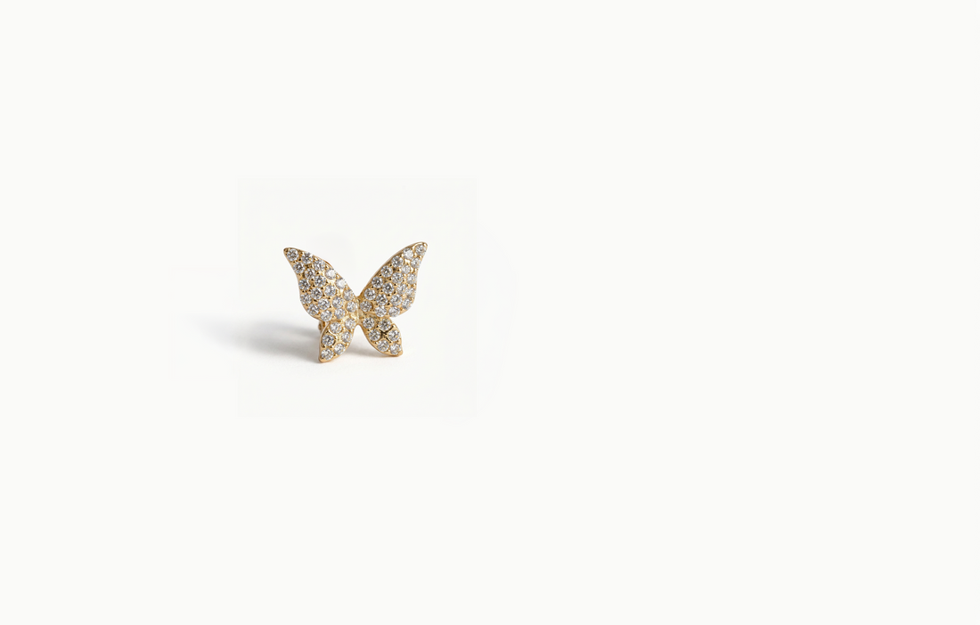 Gold butterfly ear cuff covered in crystals