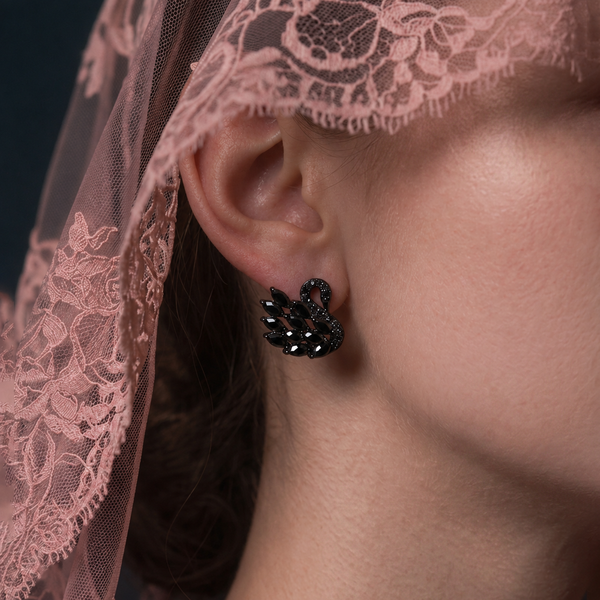 Black Swan earrings, black crystal swan worn on the ear under a pink lace veil