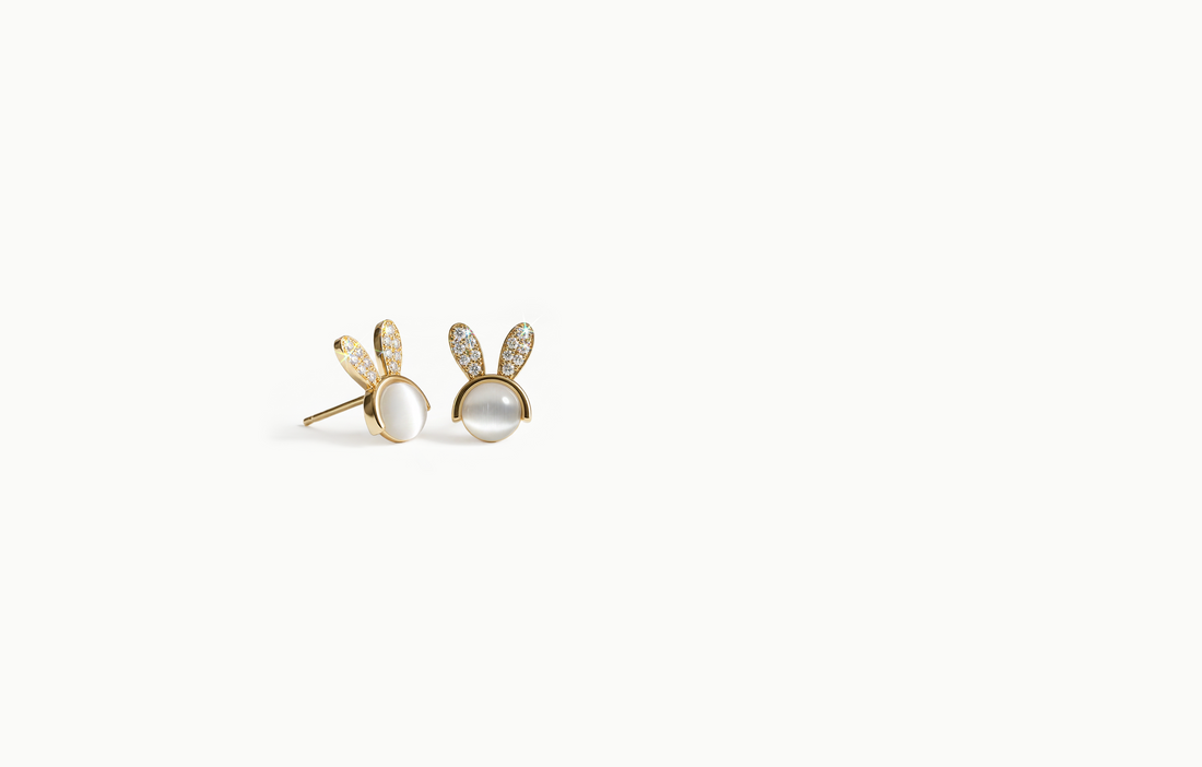 Mini gold stud earrings with a white centre and crystal bunny ears