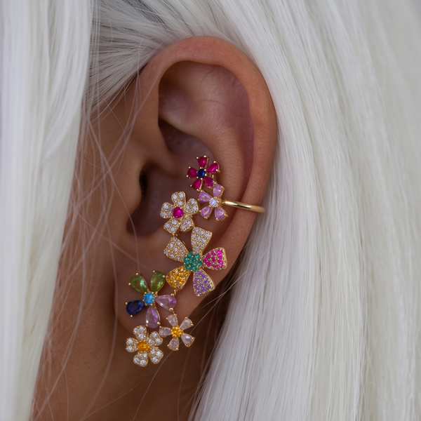 Meadow Valley crystal earrings worn on the ear, colorful flower cluster climbing the ear, white hair