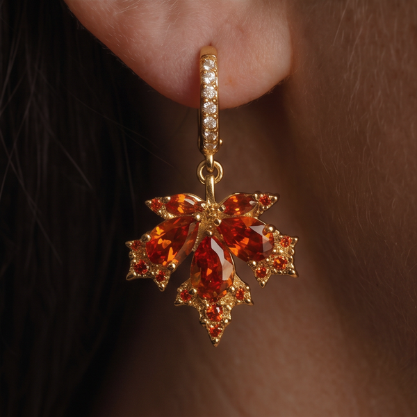 Maple Leaf crystal drop earrings, close-up of an orange-red crystal leaf dangling from the ear